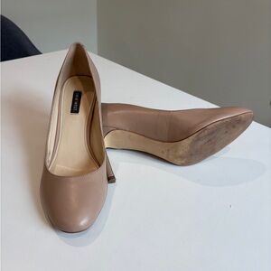 Well used nude office pumps